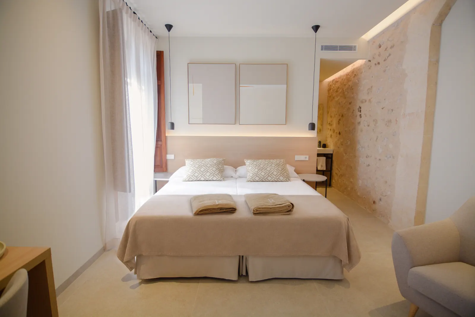 Double Superior Room full view with stone wall