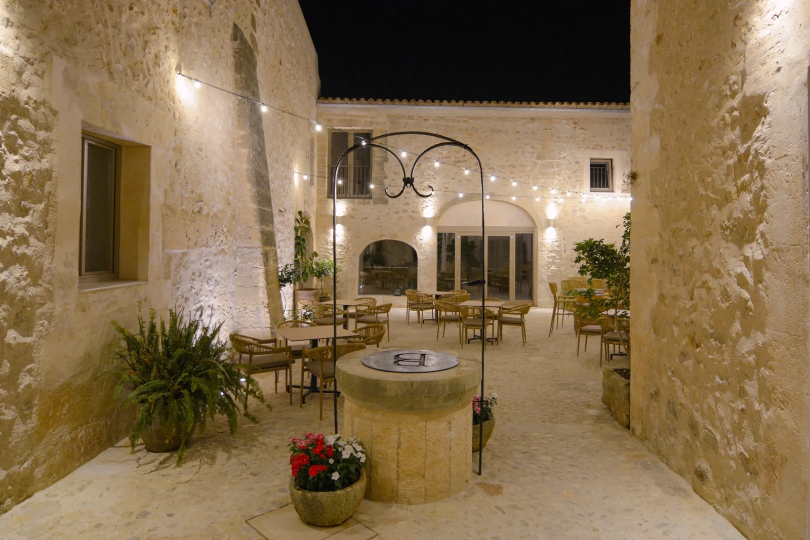 Courtyard at BYTRA Boutique Hotel by night