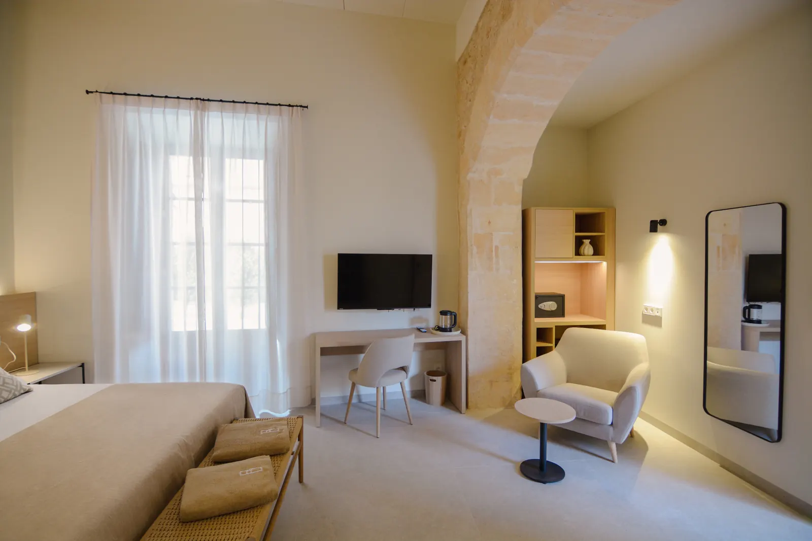 Double Room seating area with historic arch